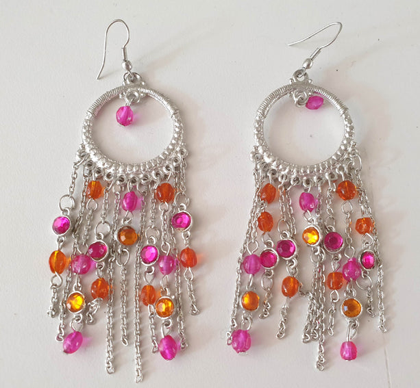 Silver-colored earrings with fuchsia and orange stones
Nickel free