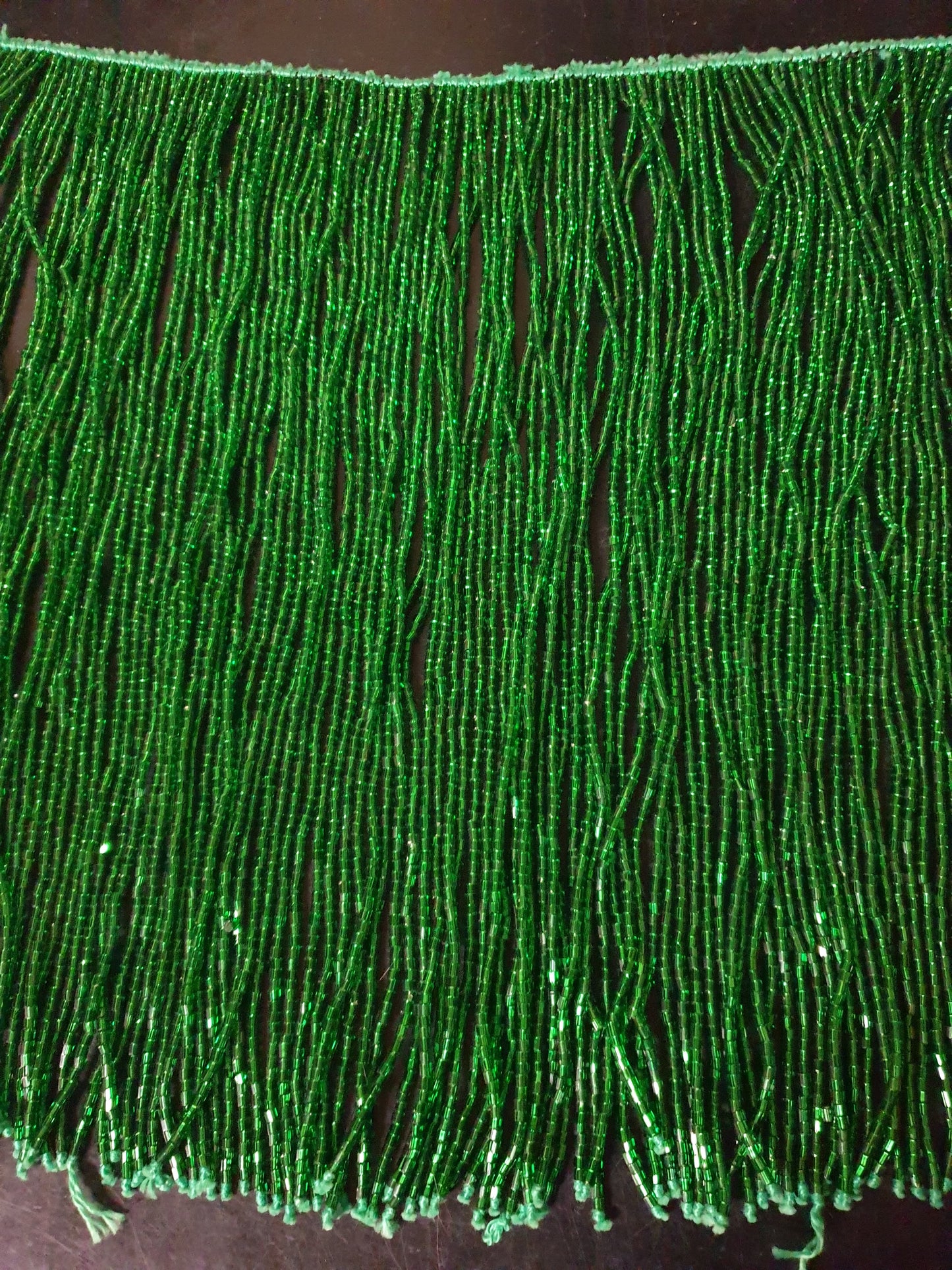 Beaded string with blue strands with many beads and sequins

 50cm long, strands 30cm long

 To sew on a costume yourself