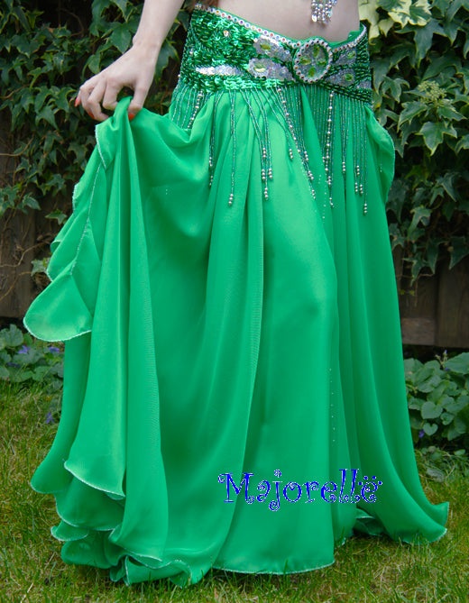 Beautiful green skirt with strips on the side. With slits on the sides