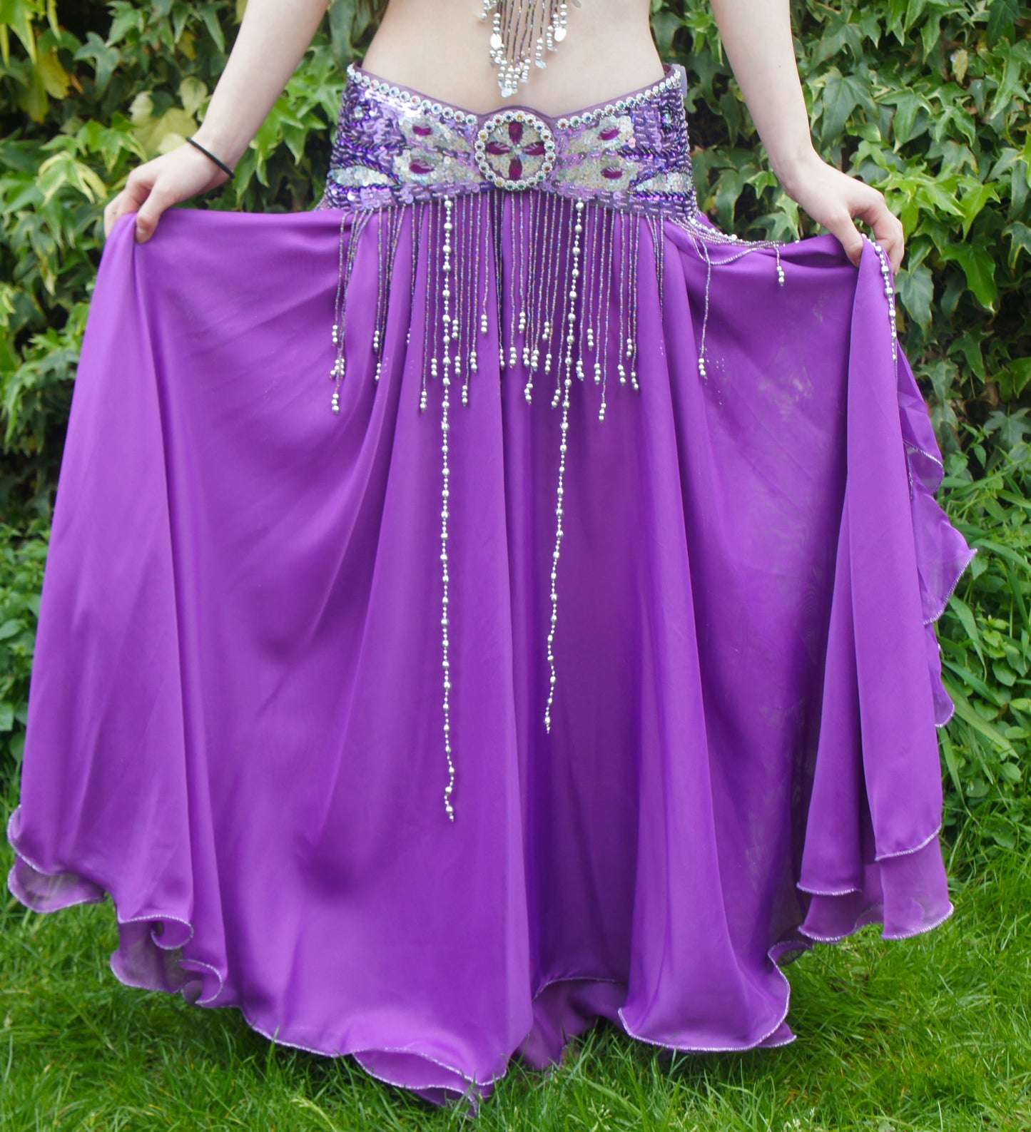 Beautiful purple skirt with strips on the side. With slits on the sides 2 layers of fabric.